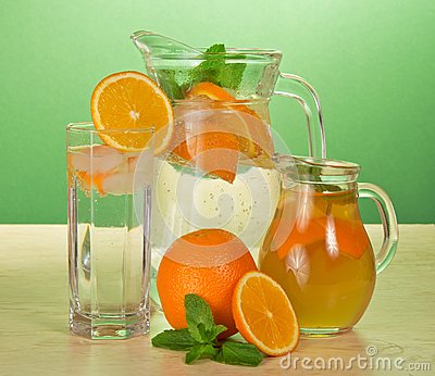 jugs-drinks-glass-oranges-table-35306937